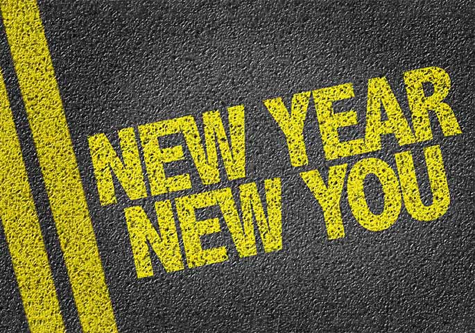 Gelbe Straßenbeschriftung New Year New You.